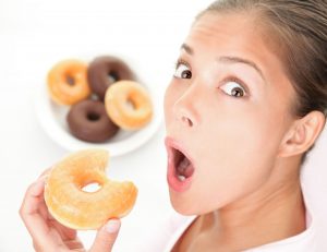 woman-caught-eating-donuts-6190817_xl